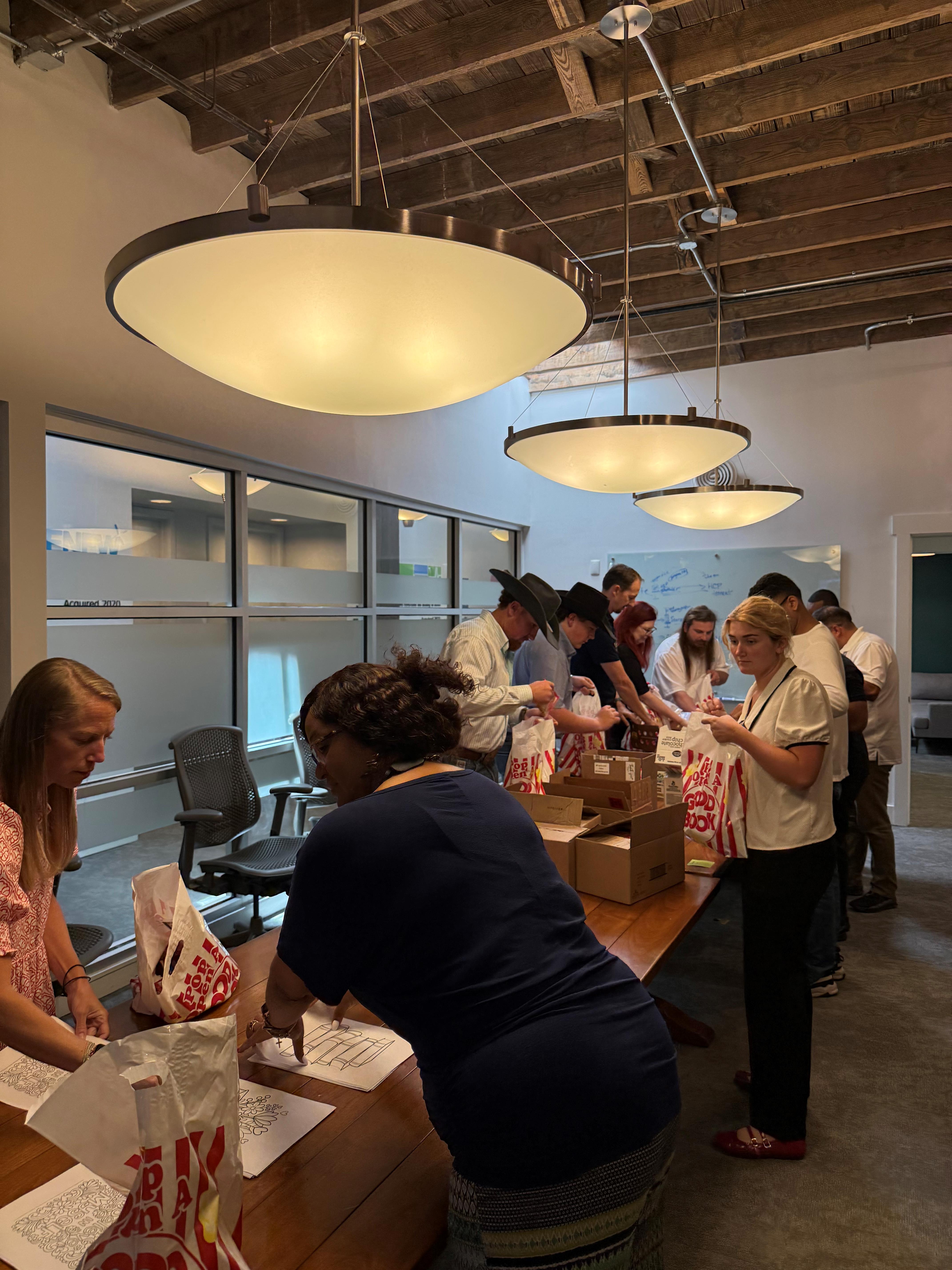 assembly line of people packing the bags