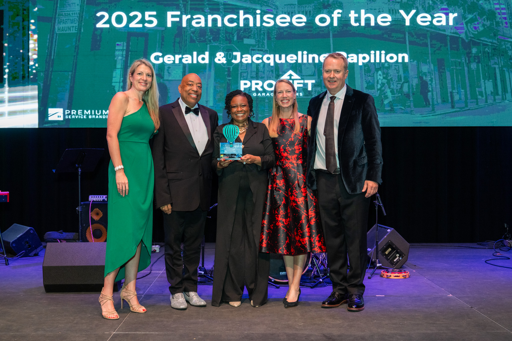 Gerald & Jacqueline Papilion receiving their award on stage