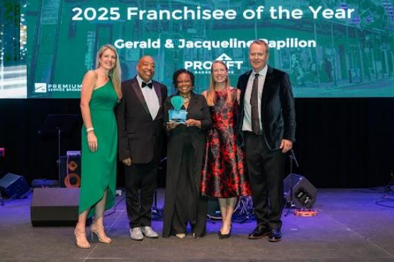 Gerald & Jacqueline Papilion receiving their award on stage